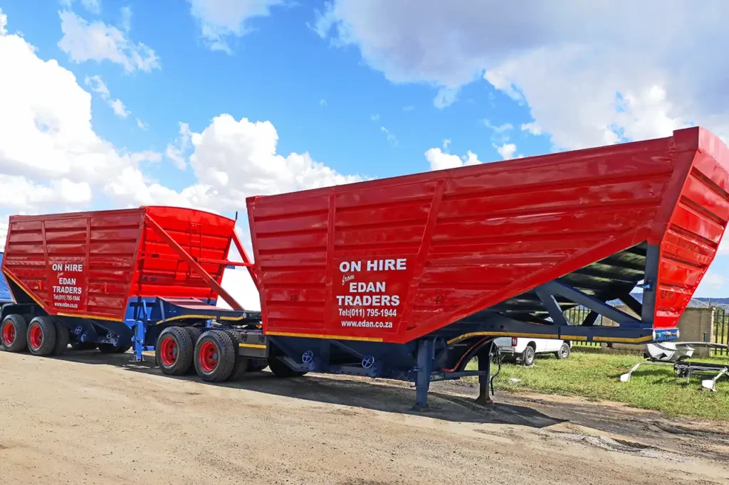 Bottom dumper grain trailer for bulk agricultural transport
