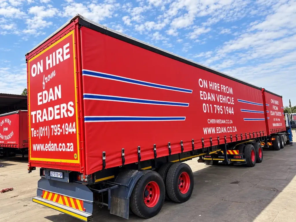 Red tautliner trailer for hire in South Africa from Edan Vehicle & Asset Hire.